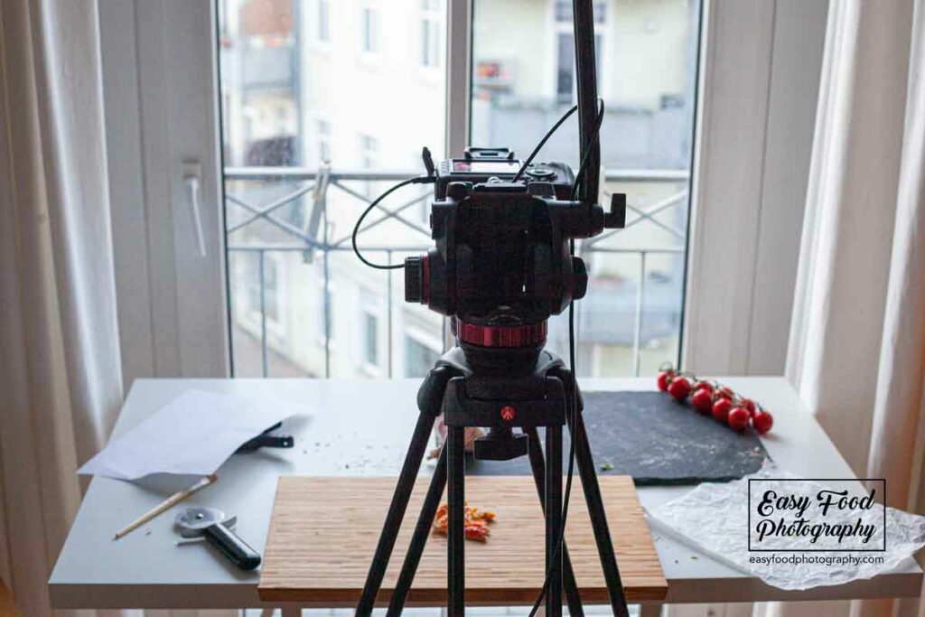 Some tripods offer the ability to tilt the camera at a 90-degree angle. But you can also build a rig with simple means.
